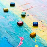 Abstract painting showcasing vibrant colors and cubes on textured canvas.